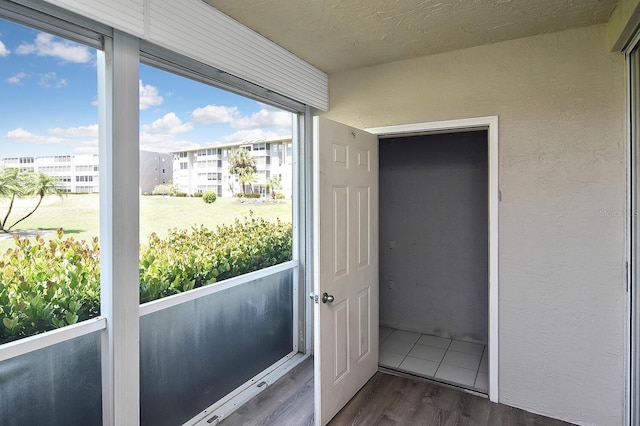 doorway to outside featuring dark hardwood / wood-style flooring