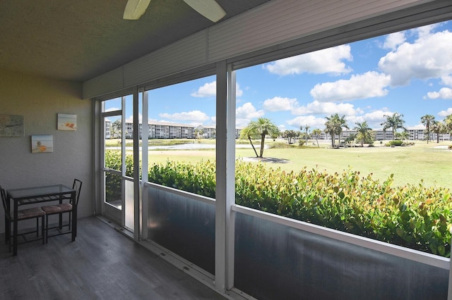 sunroom / solarium with ceiling fan