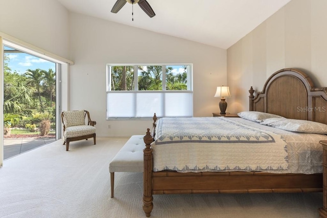 carpeted bedroom featuring access to exterior, vaulted ceiling, and ceiling fan