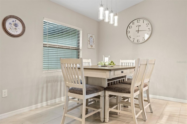 dining area with light tile patterned flooring