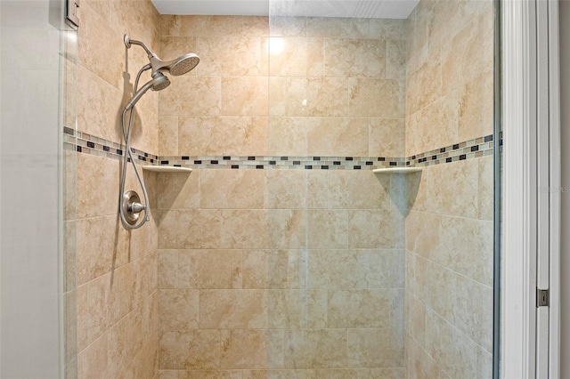 bathroom with tiled shower