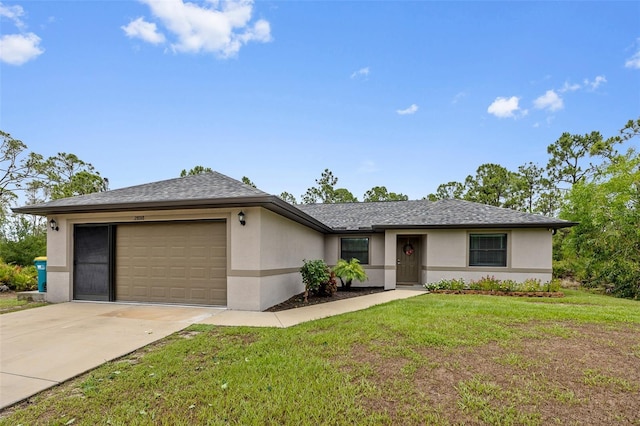 ranch-style house with a garage and a front lawn