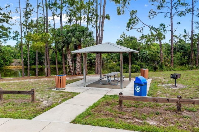 view of community featuring a gazebo, a yard, and a water view