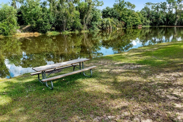 surrounding community with a water view