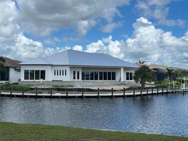 back of house featuring a water view