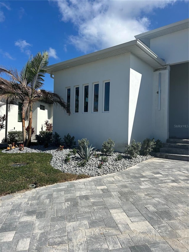 view of home's exterior with a patio area