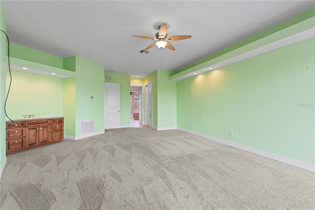 carpeted empty room with ceiling fan