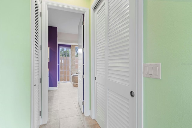 corridor with light tile patterned floors