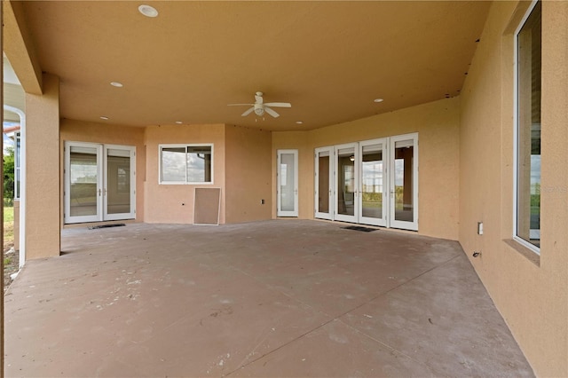 view of patio featuring french doors and ceiling fan