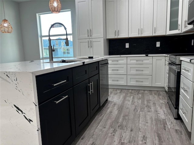 kitchen with sink, tasteful backsplash, decorative light fixtures, stainless steel electric range, and white cabinets