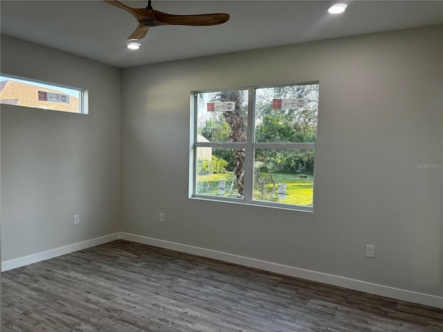 unfurnished room featuring dark hardwood / wood-style flooring and ceiling fan