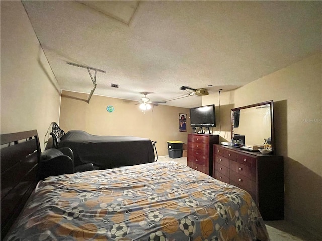 bedroom featuring a textured ceiling and ceiling fan