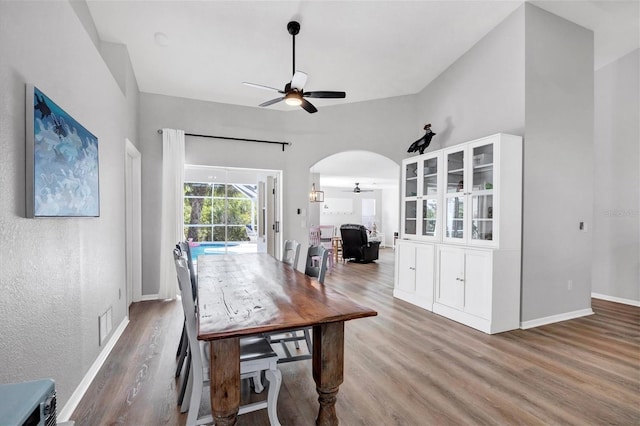 dining room with ceiling fan and hardwood / wood-style flooring