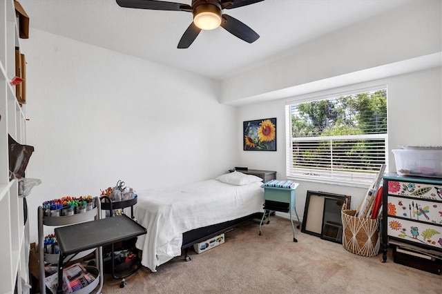 bedroom featuring light carpet and ceiling fan