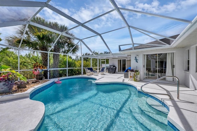 view of swimming pool with a patio area and glass enclosure