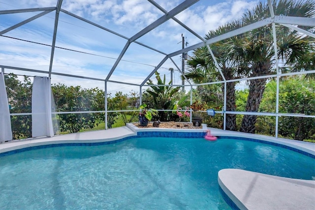 view of swimming pool with glass enclosure