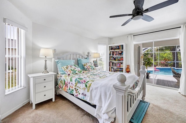 carpeted bedroom with ceiling fan, multiple windows, and access to exterior