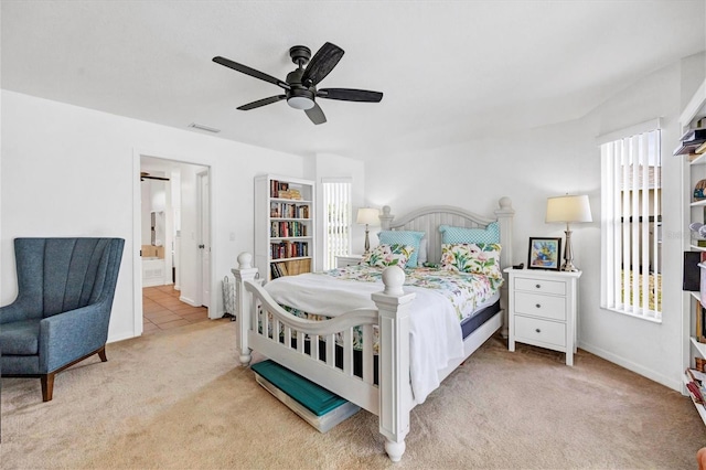 bedroom featuring light carpet and ceiling fan