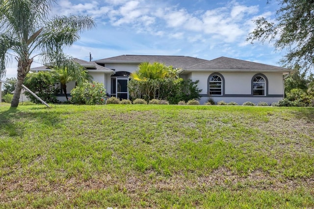 single story home featuring a front yard