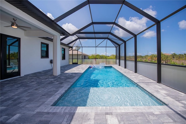 view of pool featuring pool water feature and ceiling fan