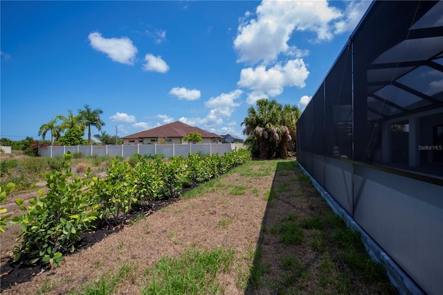 view of yard with a lanai