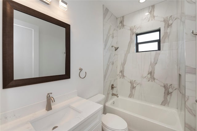 full bathroom with vanity, toilet, and tiled shower / bath combo