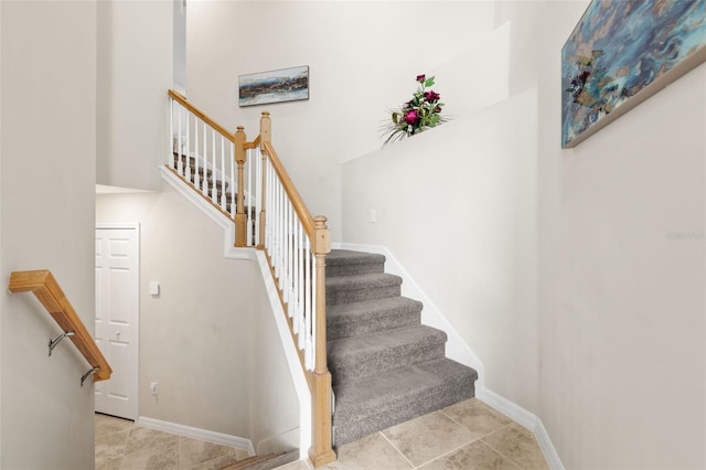 staircase with tile patterned flooring