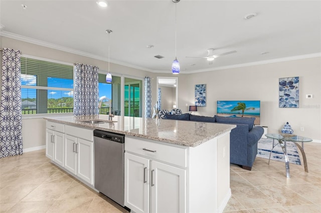 kitchen with white cabinets, decorative light fixtures, an island with sink, sink, and stainless steel dishwasher