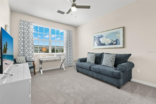 living room with ceiling fan and carpet flooring