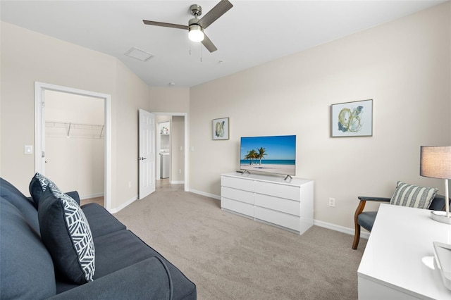 carpeted living room with ceiling fan