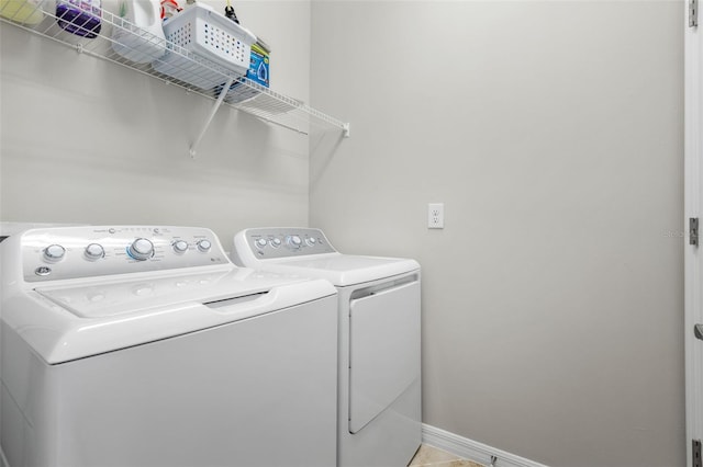 laundry area with separate washer and dryer