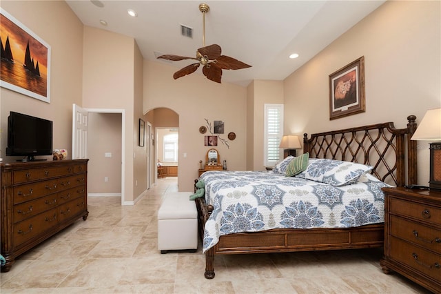 bedroom with baseboards, visible vents, arched walkways, ceiling fan, and recessed lighting