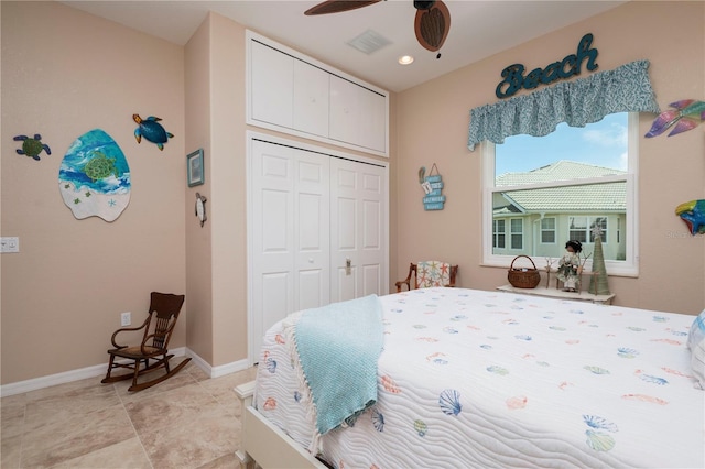 bedroom featuring light tile patterned flooring, a ceiling fan, visible vents, baseboards, and a closet