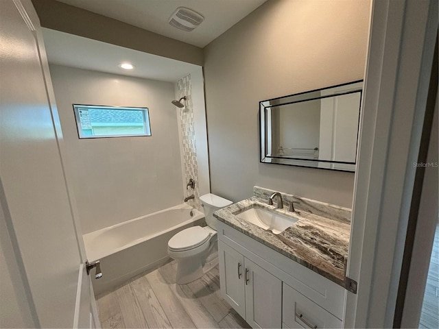 full bathroom with toilet, wood-type flooring, shower / washtub combination, and vanity