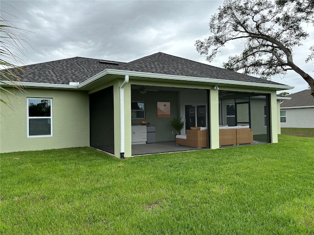 rear view of house with a yard