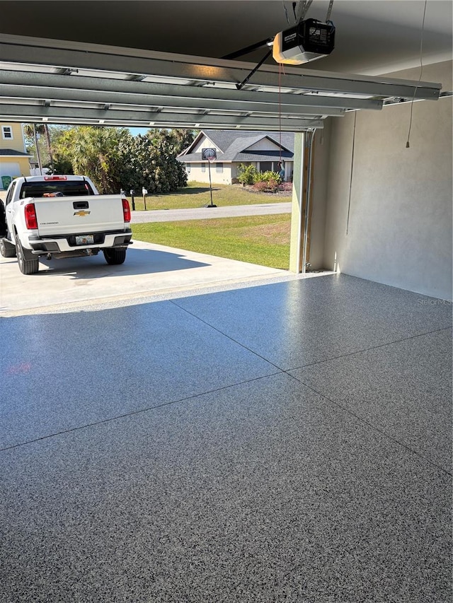 garage featuring a garage door opener