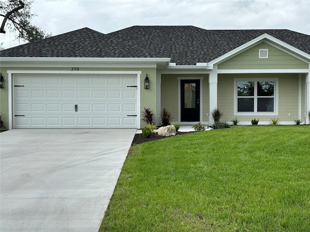 ranch-style house with a garage and a front lawn