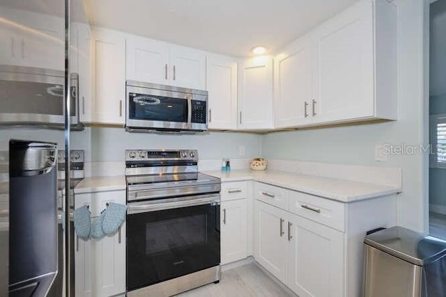 kitchen featuring white cabinets and stainless steel appliances