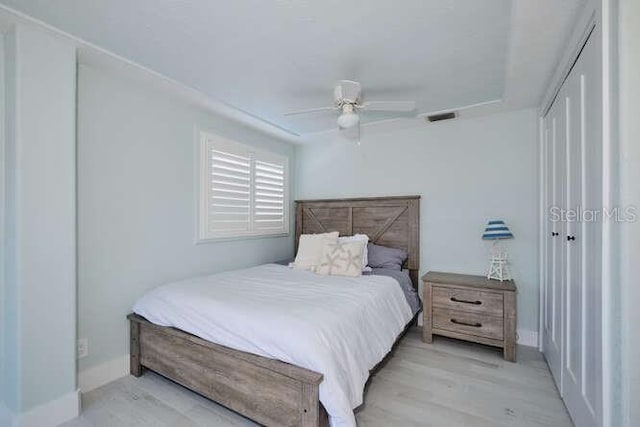 bedroom featuring ceiling fan and light hardwood / wood-style floors