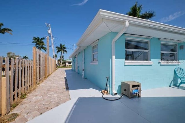 view of side of home featuring a patio area