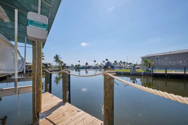 view of dock with a water view