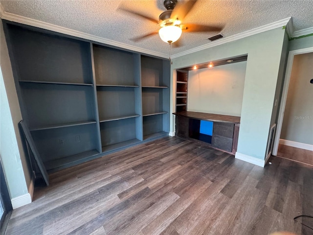 unfurnished office with ornamental molding, dark wood-type flooring, ceiling fan, and a textured ceiling