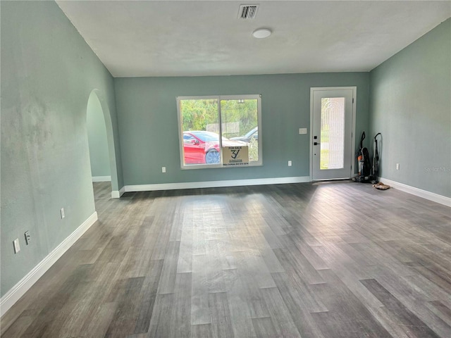 unfurnished living room with hardwood / wood-style floors