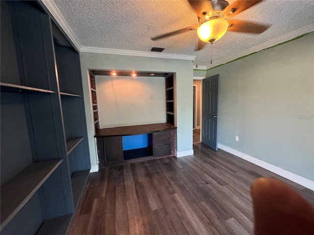 unfurnished living room with ornamental molding, dark wood-type flooring, ceiling fan, and a textured ceiling