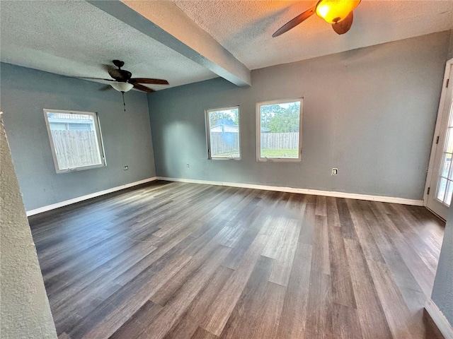 unfurnished room with ceiling fan, hardwood / wood-style floors, and a textured ceiling