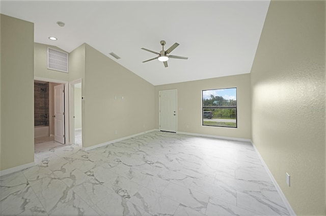 spare room with ceiling fan and high vaulted ceiling