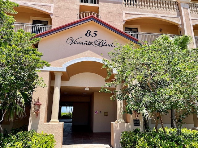 doorway to property featuring a balcony