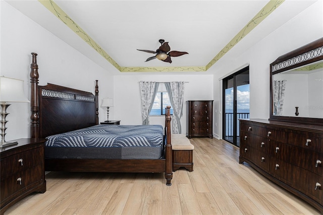 bedroom with light wood-type flooring, access to outside, and ceiling fan