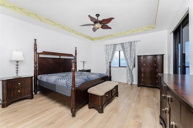 bedroom with ceiling fan and light hardwood / wood-style floors