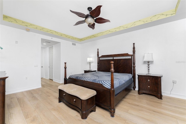 bedroom with light wood-type flooring and ceiling fan